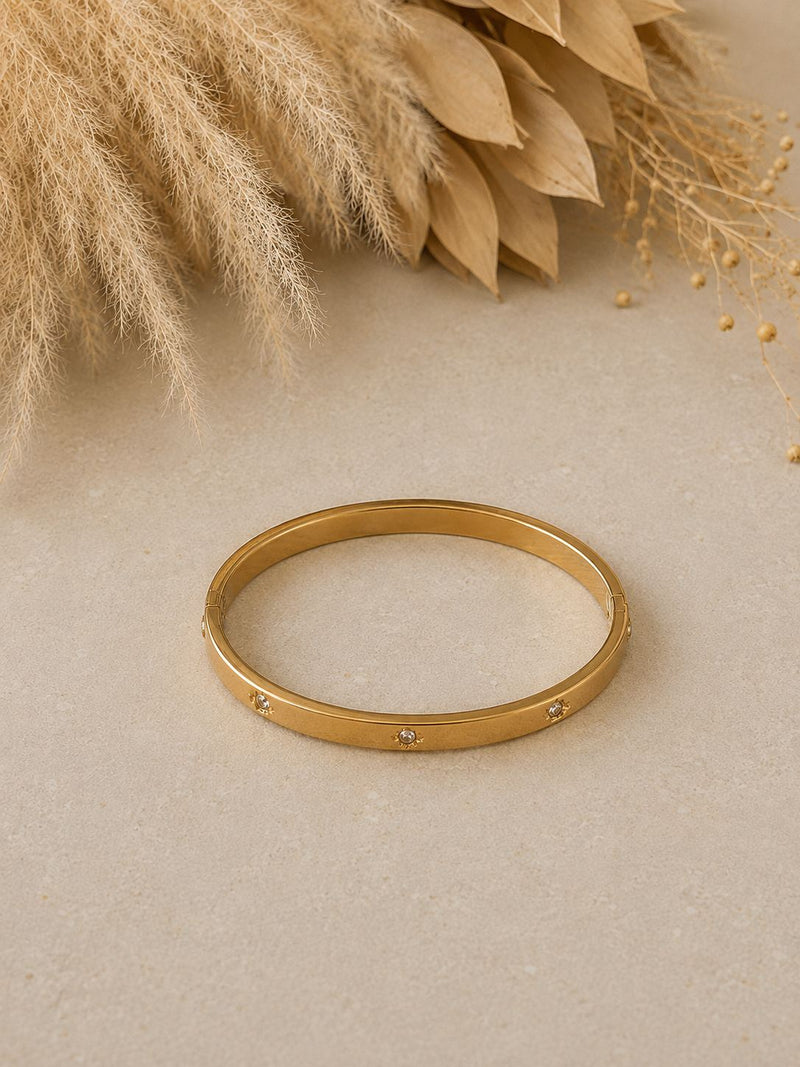 Pulsera dorada con punto de luz bañada en oro 18K