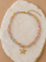 Collar de piedra multicolor con estrella de mar dorada