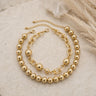 Conjunto de collares dorados con pelotas y eslabones